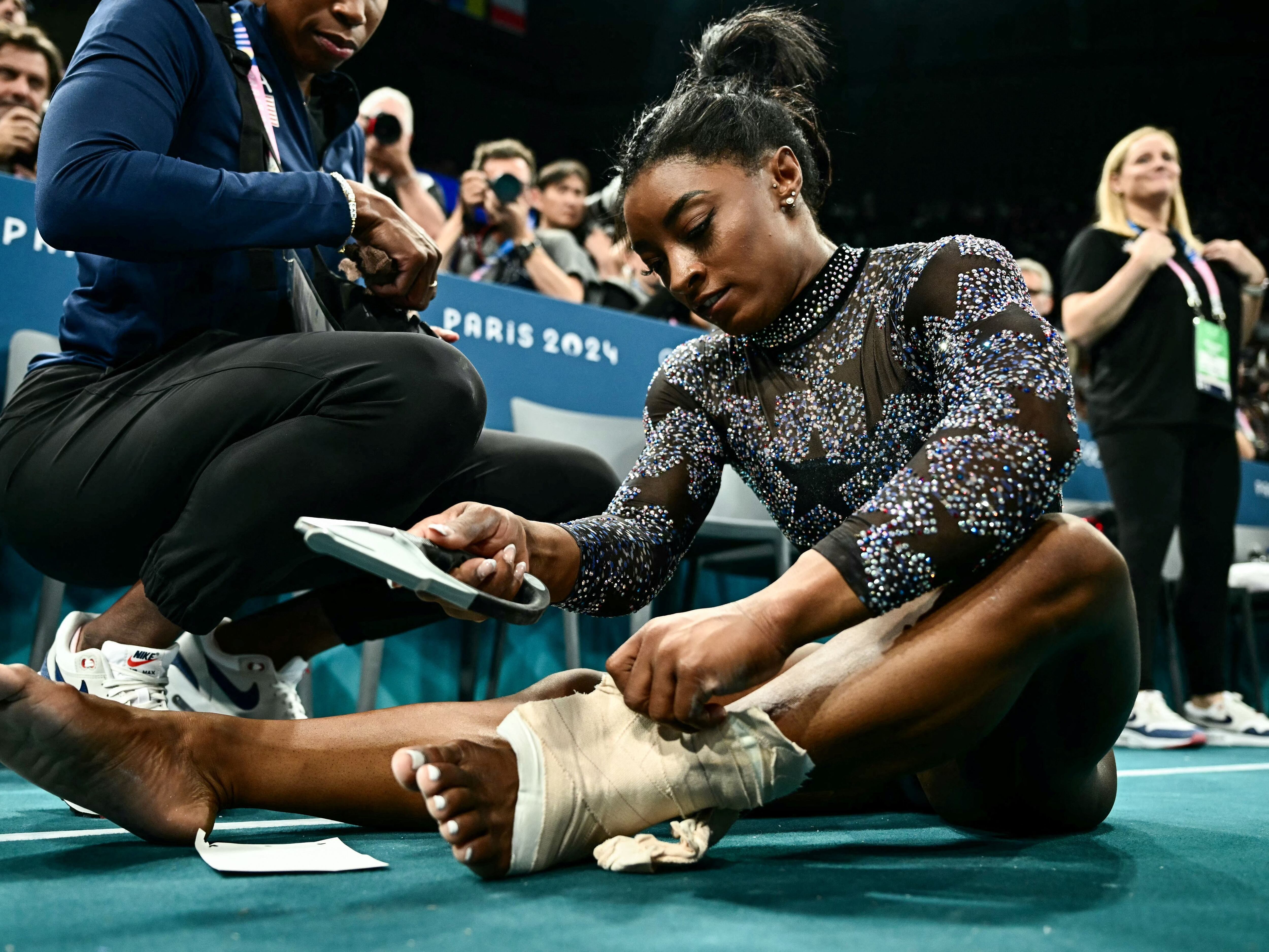 Simone Biles hurts her leg in Olympic gymnastics qualifying but finishes  1st anyway - OPB