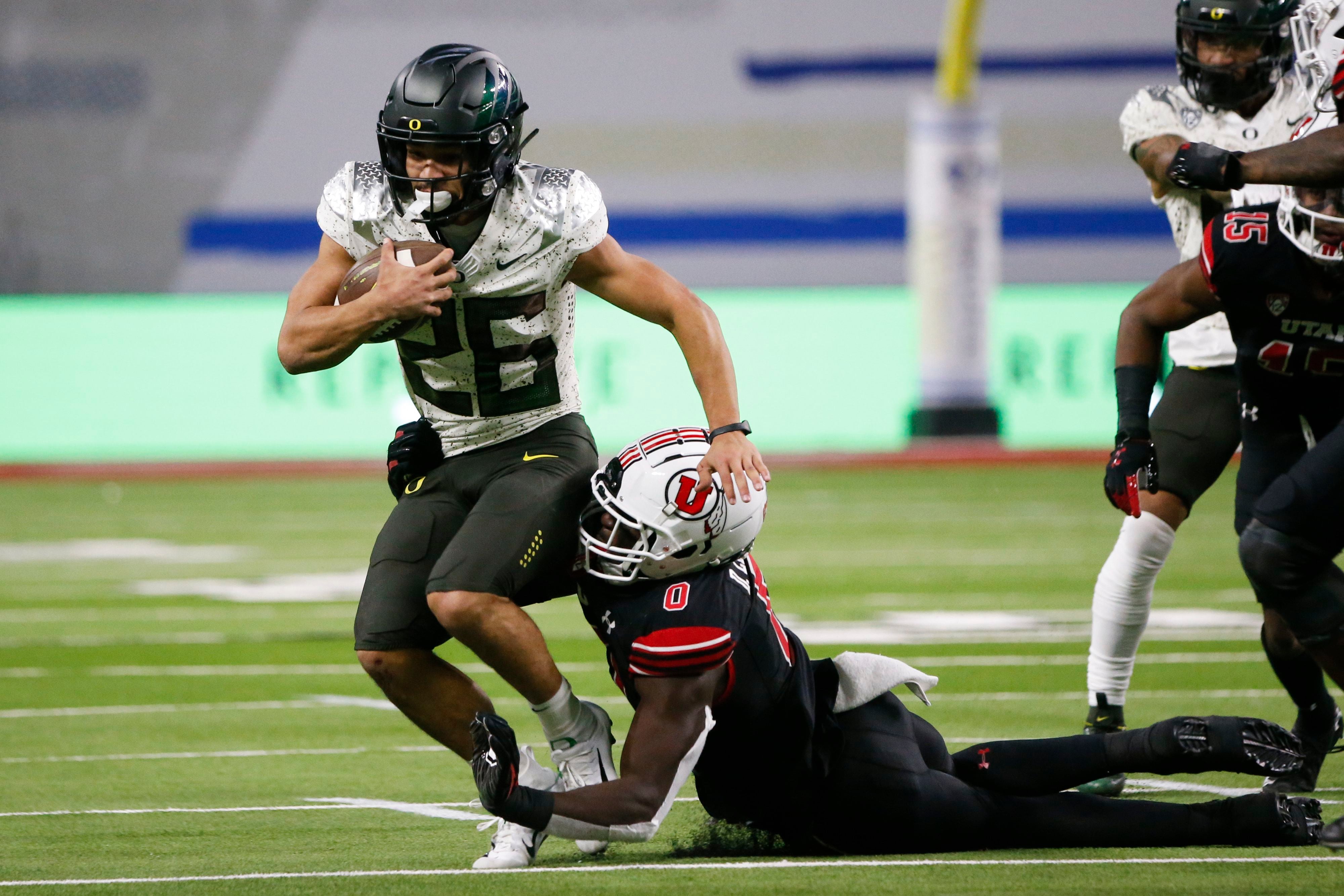 No. 14 Utah beats No. 10 Oregon 38-10 for 1st Rose Bowl bid - OPB